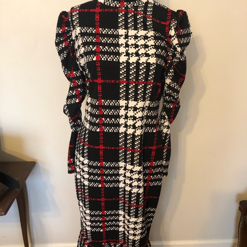 A line dress w flare bottom and bell sleeves .